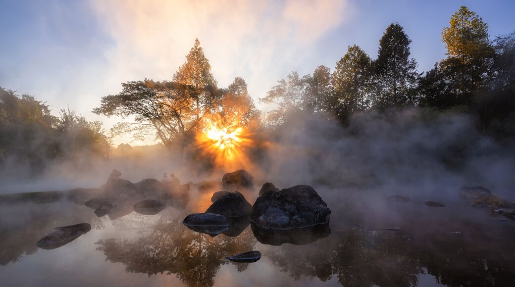 The hot spring with a 73 degree Celsius water spring over rocky terrain. heat from the hot spring providing a misty and picturesque scene which is particular beautiful in the morning.