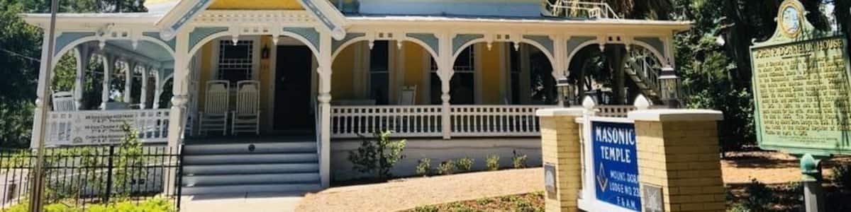 AKA The Donnelly House
John P. Donnelly came to Mount Dora in 1879 from Pittsburgh, PA. He married Annie McDonald Stone in 1881 and built this Queen Anne style house in 1893 as a gift to her. He was among the founders of the local yacht club, and served as the city´s first mayor in 1910. The Donnelly House, now owned by Mount Dora Lodge #238, F&AM, was listed in the National Register of Historic Places on April 4, 1975.
Mount Dora is a cute town on the banks of Lake Dora surrounded by antiquing opportunities and is just a short drive to the massive Renningers Antique Market