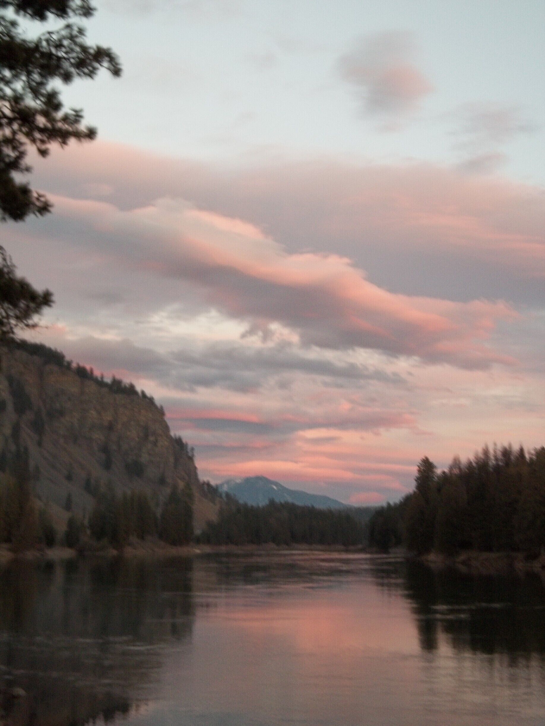 Sunset at the Cabinet Gorge, where an ice dam held back Great Lake Missoula during the glacial era.  Rocks from here were swept all the way to the Pacific Ocean when the dam broke (more than once).  If you're fishing at The Last Resort, this is the view upstream.