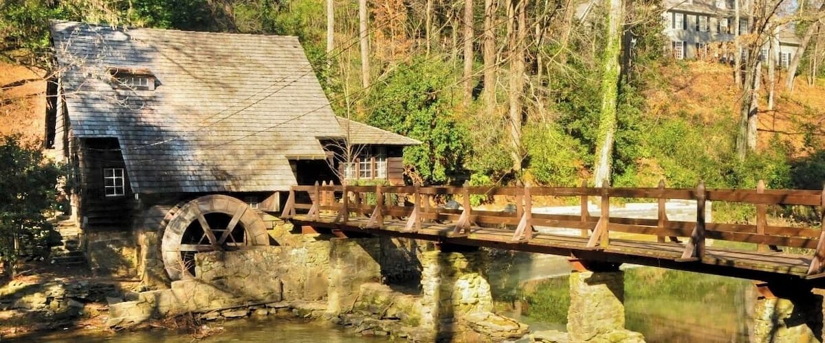 Aaaah Back home! Mountain Brook is were it all began for me many moons ago!
This image is of "The Old Mill" or "Old Mill House", a 1926 replica of Perryman's Mill built by the Jemison Companies to promote the newly-developed residential suburb of Mountain Brook. It is located on the foundations of the earlier grist mill, on the bank of Shades Creek at 2780 Mountain Brook Parkway. 
Tip - Early morning is better. Be aware this is a private residence in a residential area... not a tourist attraction. There is a linear park with a popular running trail along this road. Plenty of pull in parking spots along the side of the road and a great place to watch the fabulous Mountain Brook housewives strut their stuff.
#TroverDetour