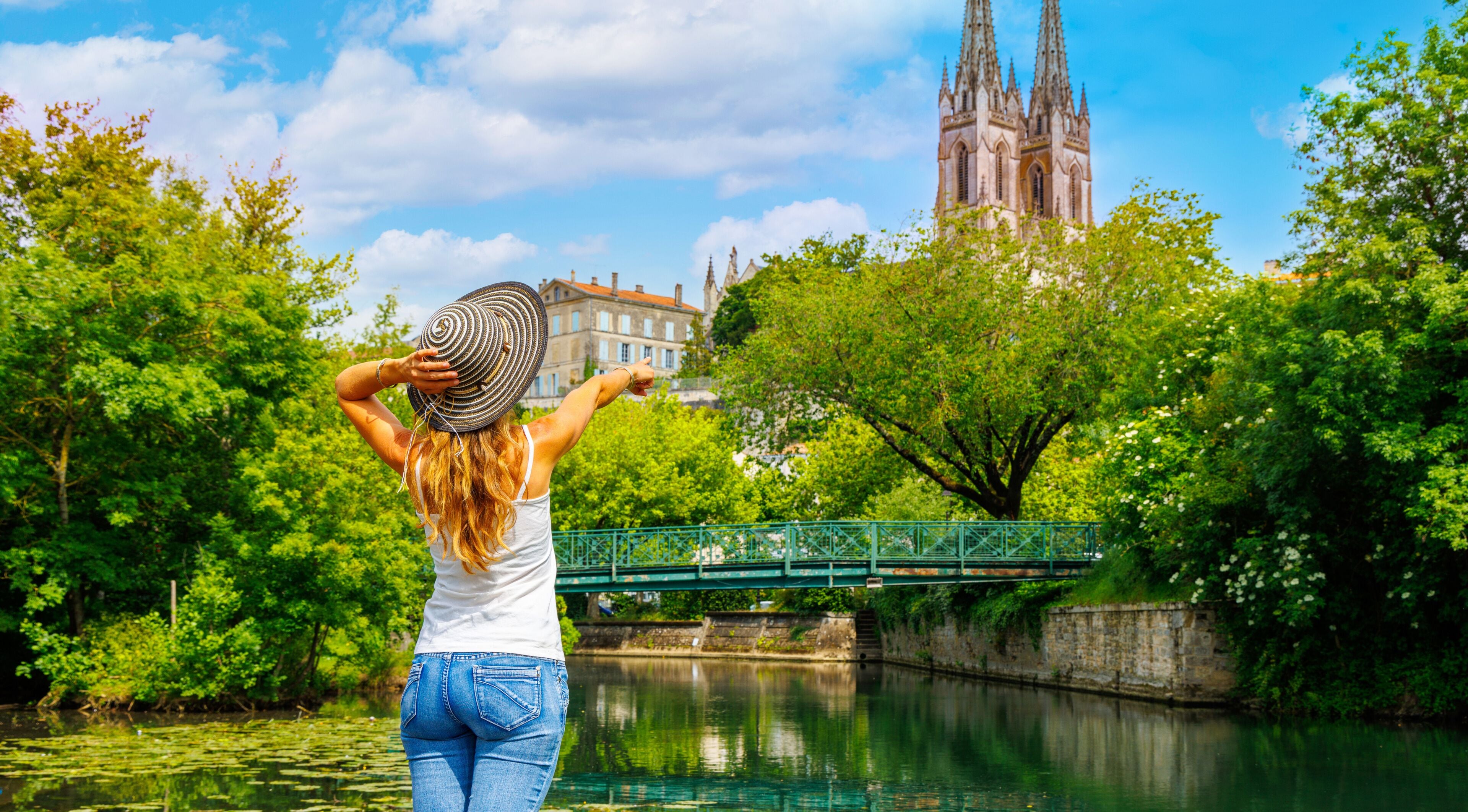 Woman tourist in France- Niort city landscape, Deux-Sèvres, Poitou Charente region