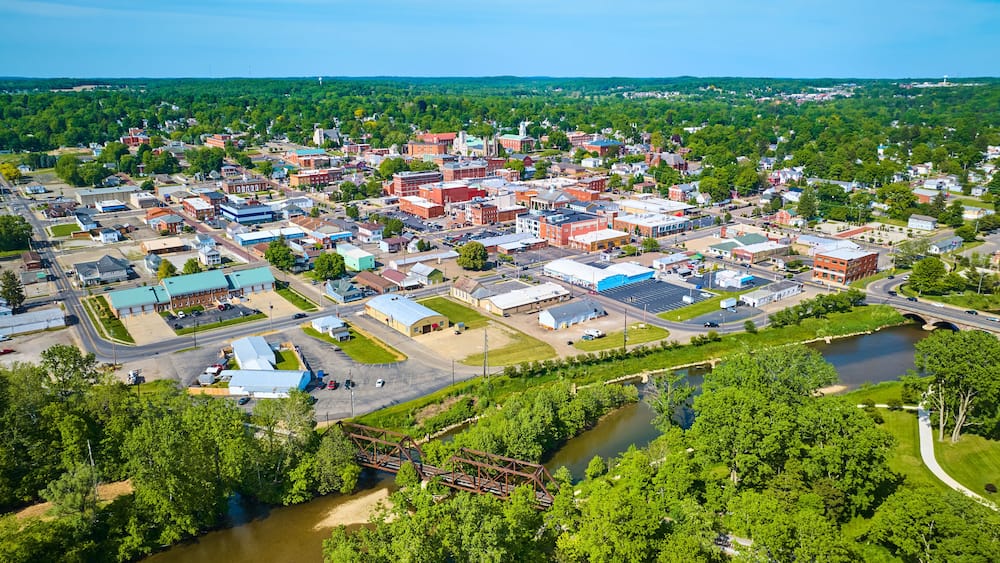 Aerial view of park area leading to wide view of Mount Vernon city in Ohio