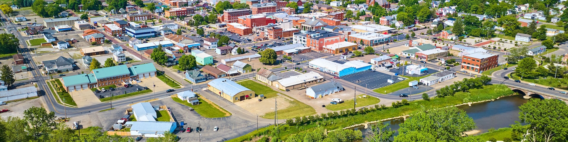 Aerial view of park area leading to wide view of Mount Vernon city in Ohio