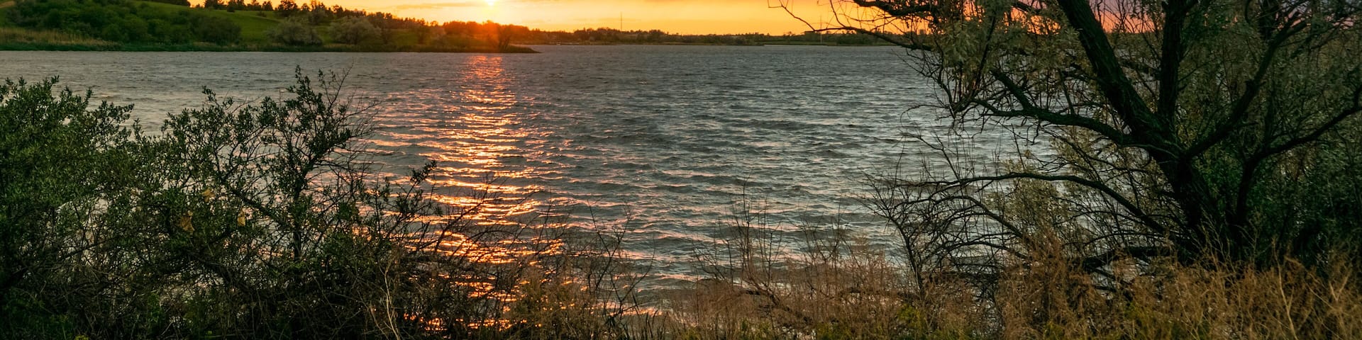 Panorama of a sunset over Sweet Briar Lake in North Dakota