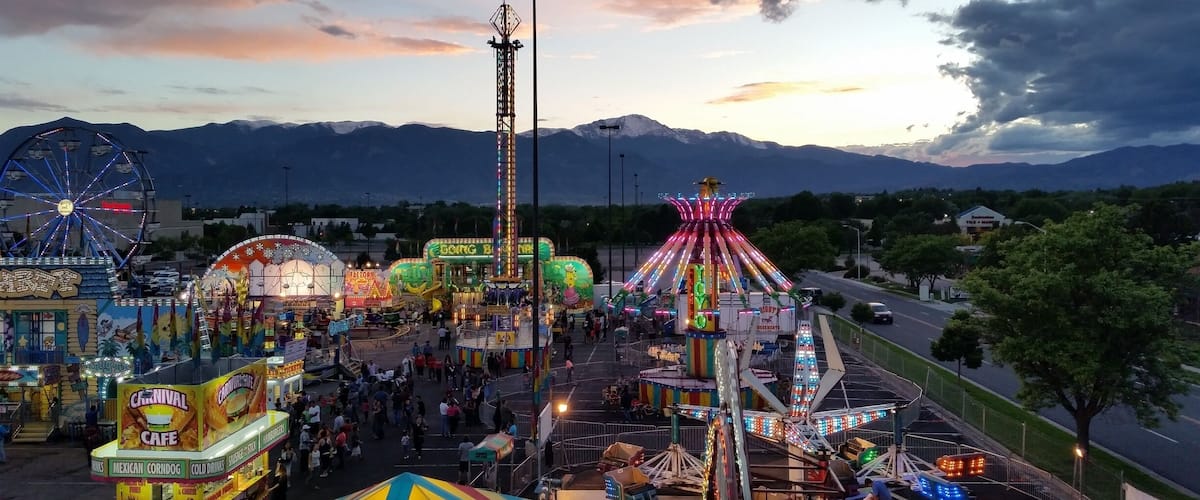 Sometimes you can get lucky and find a carnival at the mall parking lot. We rode the ferris wheel at the perfect time to catch this great sunset. 
#Colorful #Colorado #Carnival