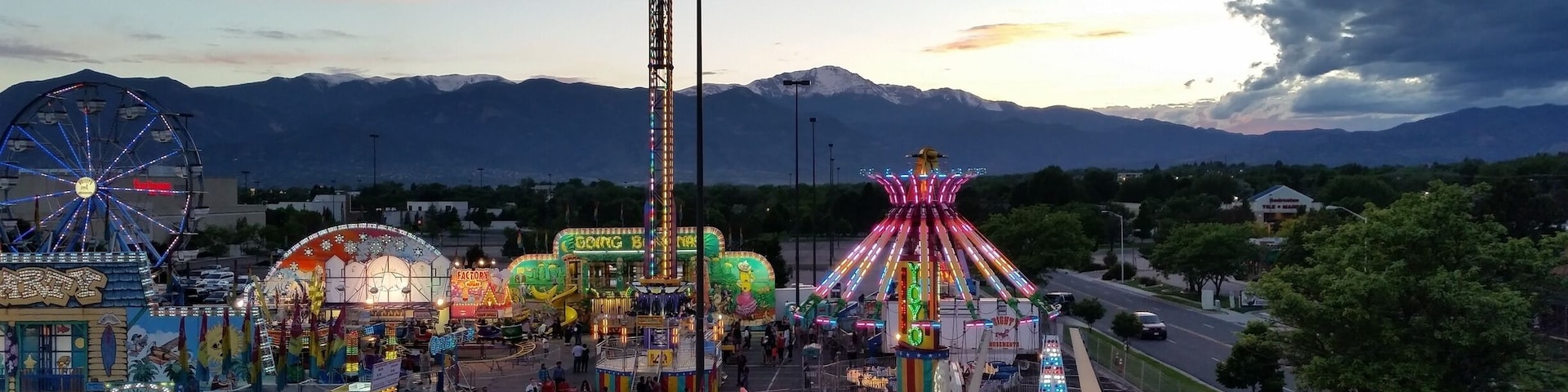 Sometimes you can get lucky and find a carnival at the mall parking lot. We rode the ferris wheel at the perfect time to catch this great sunset. 
#Colorful #Colorado #Carnival