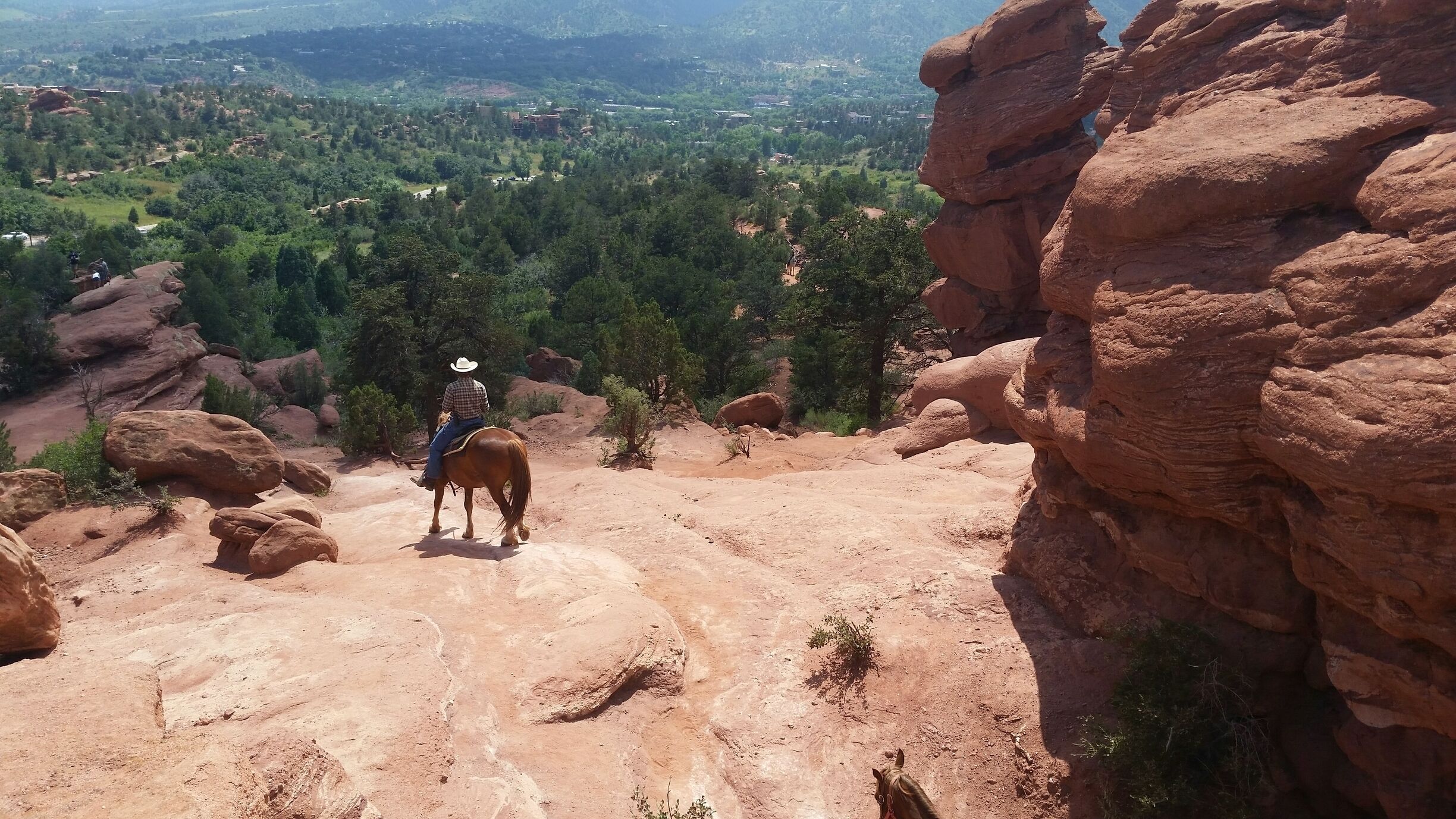 The Siamese Twins Trail is an easy 1 mile roundtrip, with less than a 150 foot rise. There is a unique view of Pikes Peak through the natural window of the twins.
