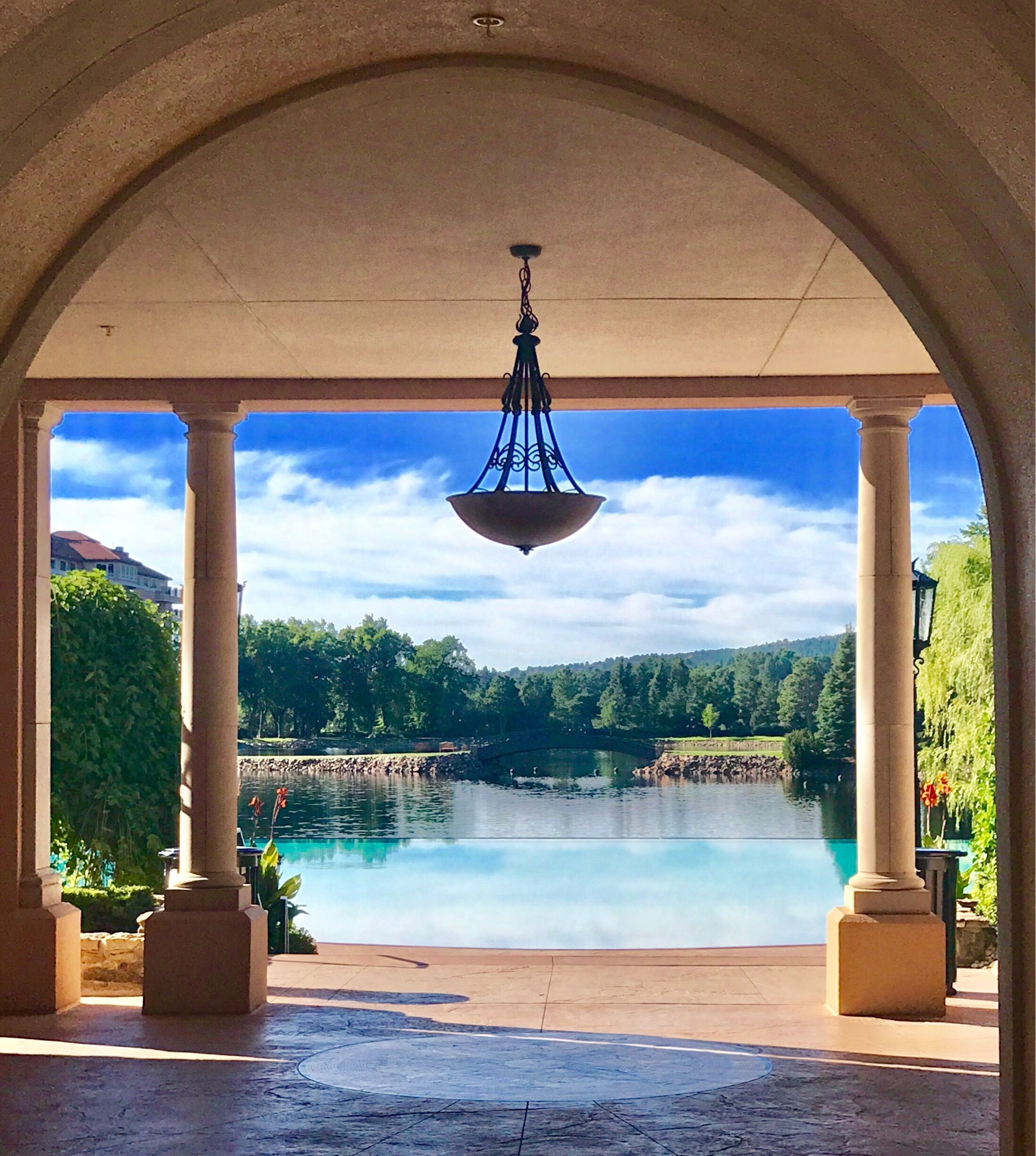 Morning view of the infinity pool to the lake and beyond to the mountains! Gorgeous resort!