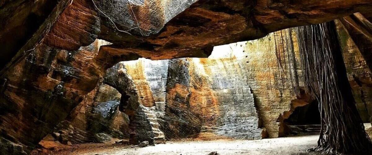 The Naida Caves in Diu
Naida caves are located close to the Diu Fort, behind the Arabian Sea. Many individuals say that these are man-made caves while others believe it to be a natural one.
When the Portuguese ruled Diu, Diu Fort was their main colonial headquarters. It is believed that Portuguese while erecting the fort seized building materials from these caves which resulted in the troughs and crests of the cavern. Long after the Portuguese left the domicile, the caves were subjected to natural wear and tear which bequeathed the caves its present shape. The caves start at a much lower distance from ground level.
Diu is one of the finest destinations in India. Though lesser explored as compared to several travel destinations in India, Diu boasts of forts, churches, temples and clean beaches. This Union Territory was ruled by the Portuguese for over four centuries and has an evident influence of the colonizers in everything from language to food and architecture to culture.