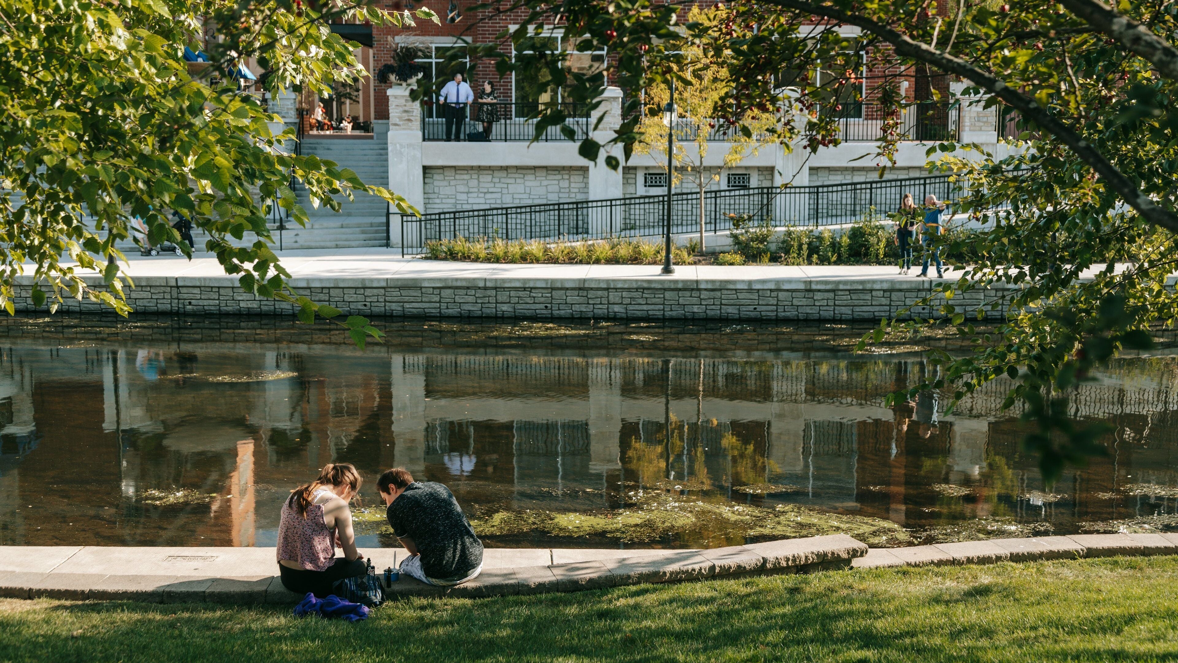 Naperville showing a garden and a pond as well as a couple