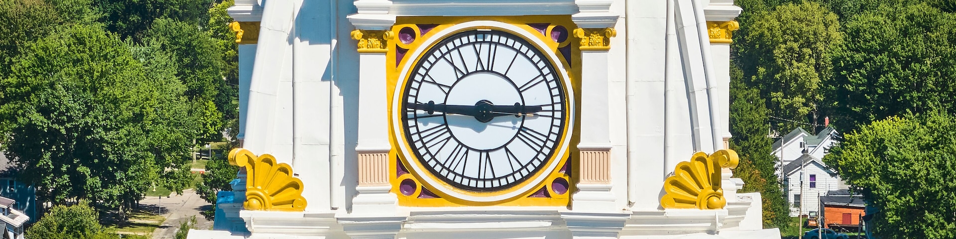 Aerial Detail of Ornate Clock Tower with Verdant Backdrop in Napoleon Ohio