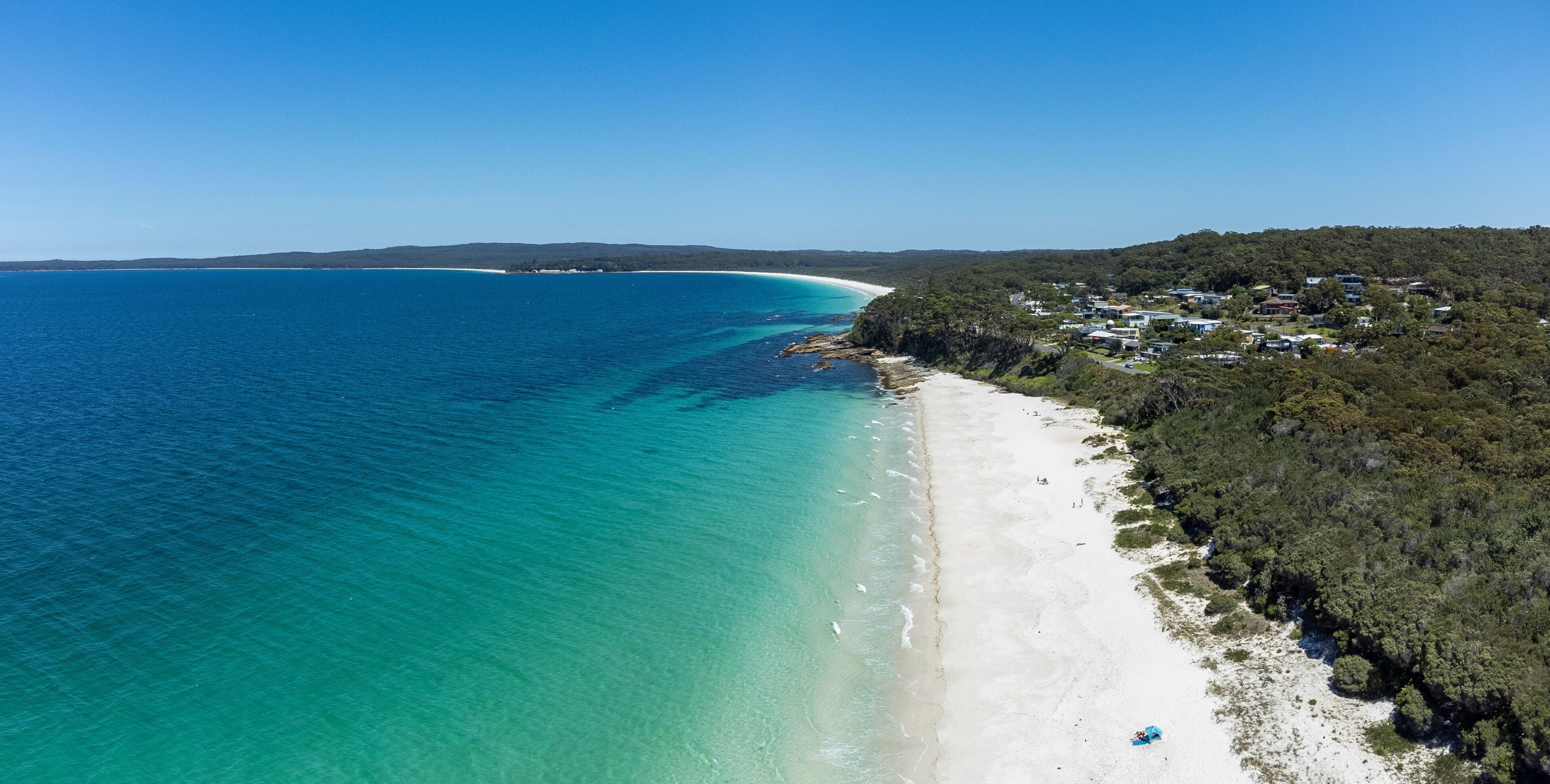 Aerial view of  the beautiful Chinamans (in distance) and Greenfield beach in NSW, Australia, a popular white sand swimming beach