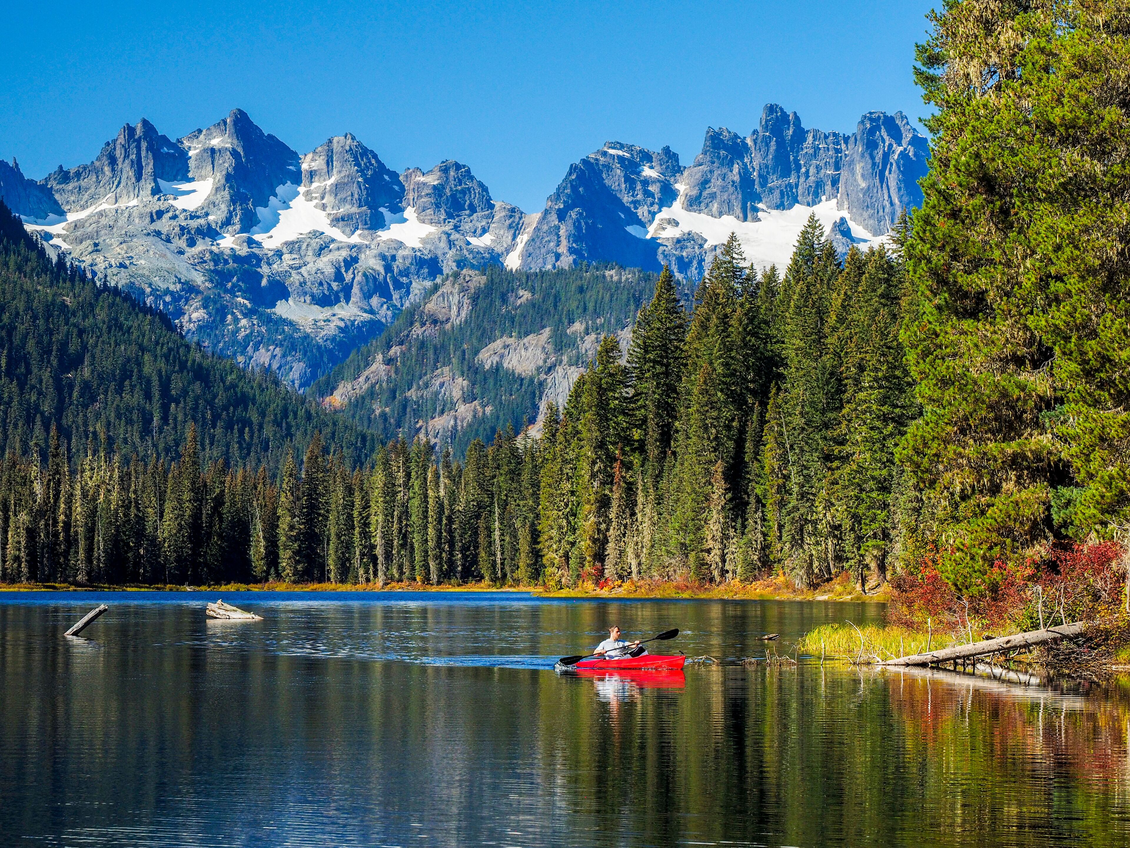 USA, Washington State, Cle Elum, Kittitas County. Red canoe on Cooper Lake.
