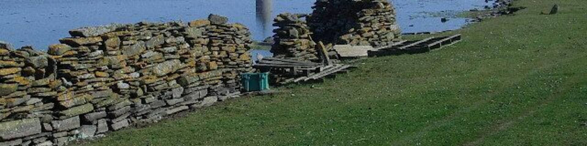 North Ronaldsay. The old beacon seen across Dennis Loch.