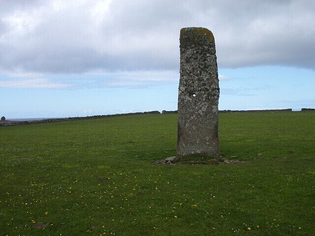 Standing stone on North Ronaldsay. The hole through the centre of the stone can be seen clearly here.