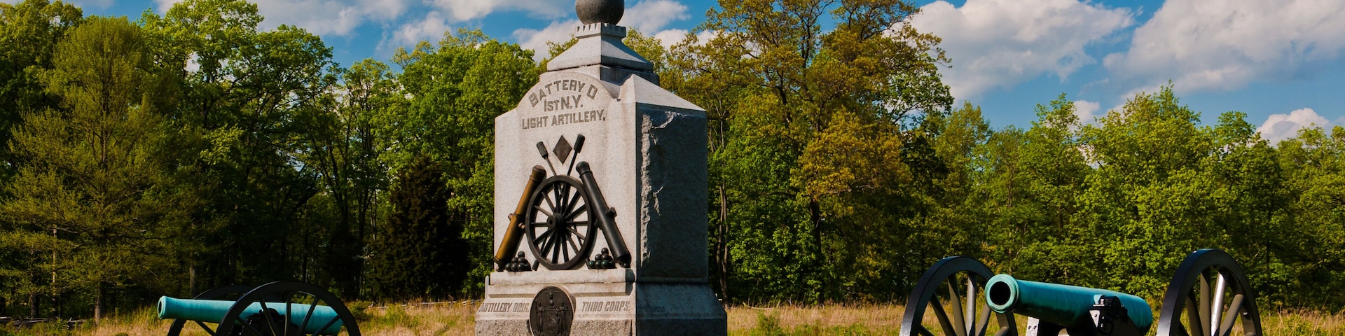 Cannons and a monument on the battlefield at Gettysburg, Pennsylvania.