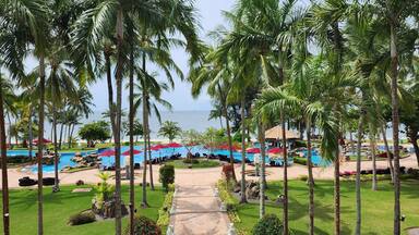 Tropical beach with palm trees at Bintan Island, Indonesia