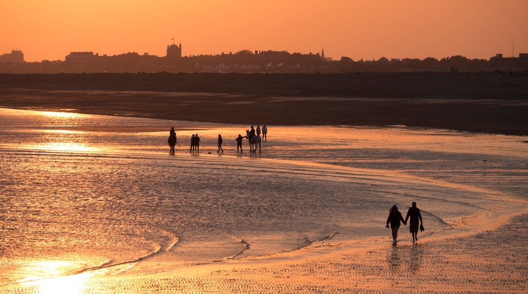 Beach at south end of Hayling island is turned golden by sunset