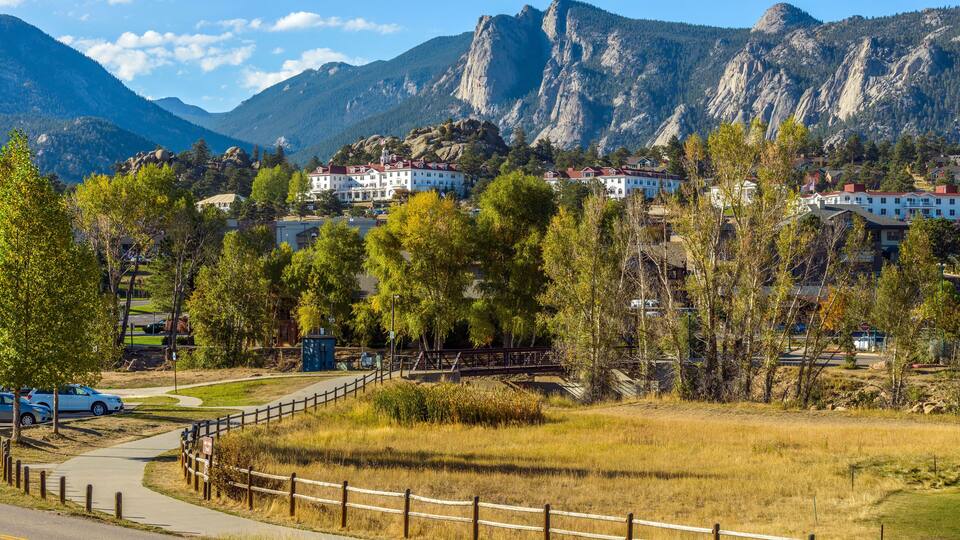 Estes Park - An autumn afternoon at Downtown Estes Park, with The Stanley Hotel and Rocky Mountains in background. Colorado, USA.
