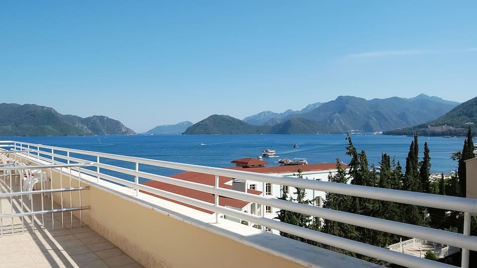 View of the blue sea and mountains from the balcony of hotel.