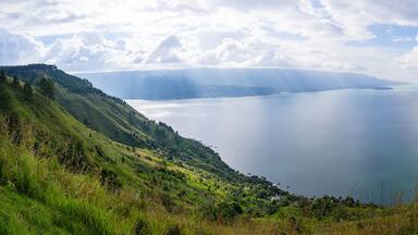 Panoramic view of Lake Toba from Smiling Hill or Bukit Senyum in Bahasa. North Sumatra - Indonesia as one of the biggest volcanic lake