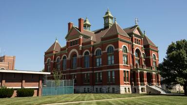 Afternoon sun shines on the historic 19th Century Franklin County Courthouse in downtown Ottawa, Kansas, USA.