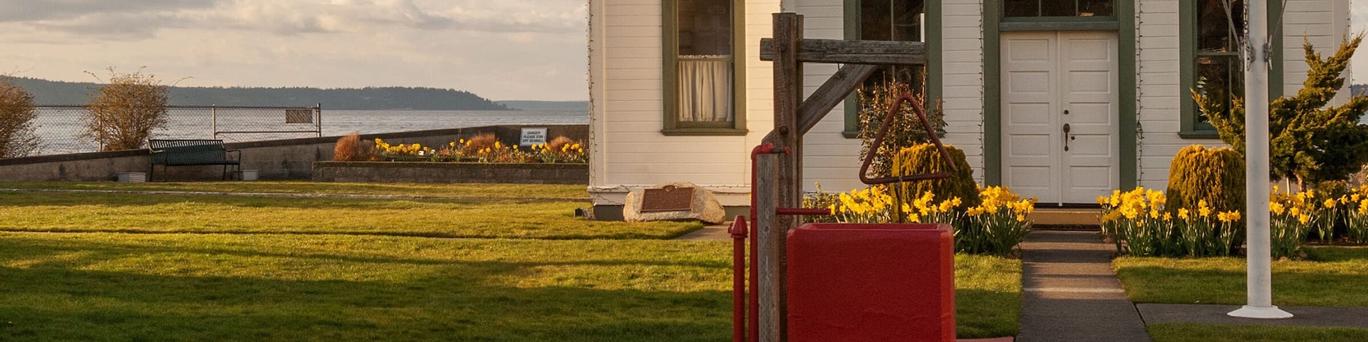 Beautiful Washington lighthouse with daffodils in spring