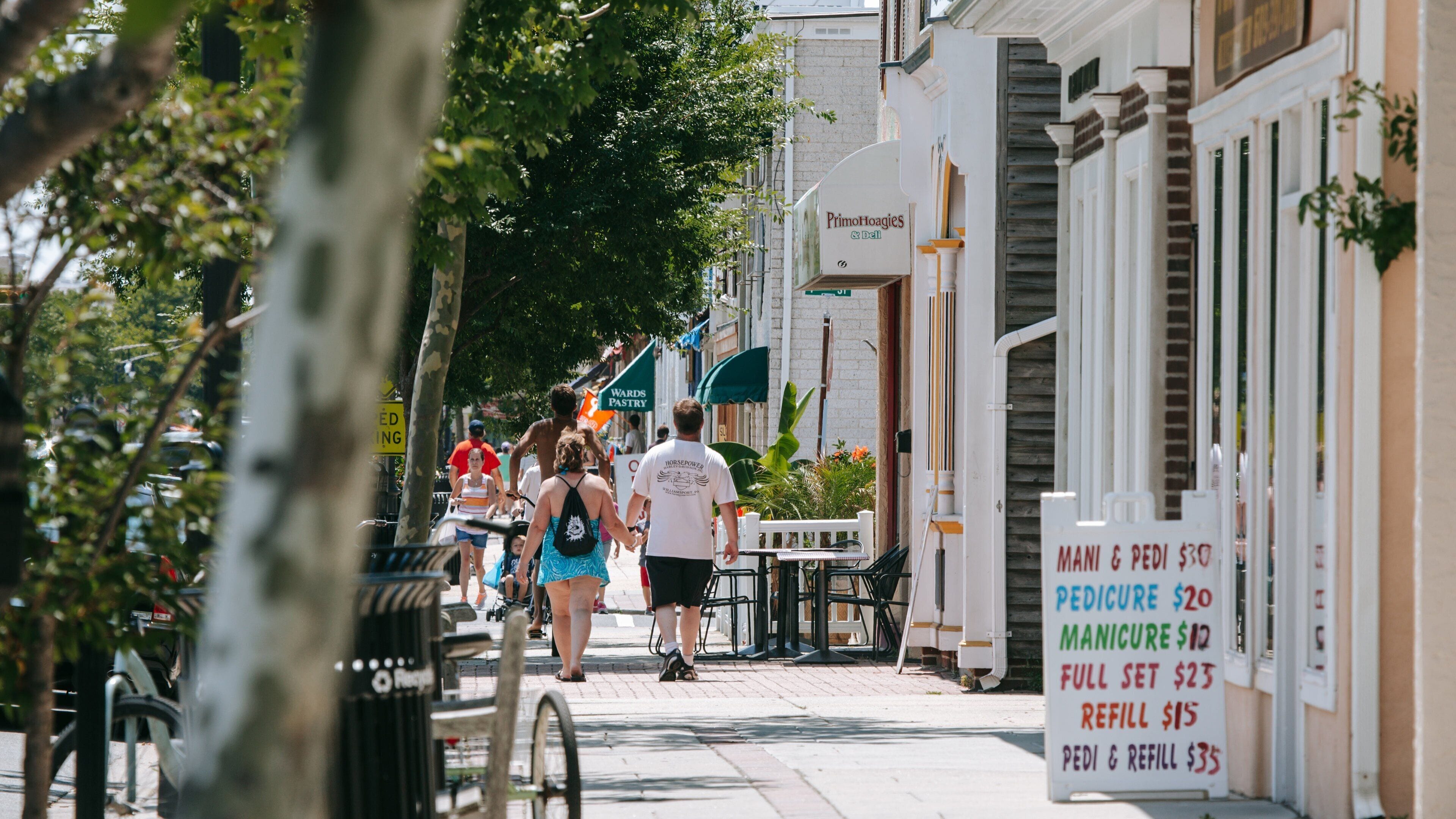 Ocean City showing street scenes as well as a couple