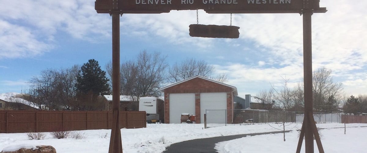 A snow-covered path leading to a building labeled 'DENVER RIO GRANDE WESTERN'.