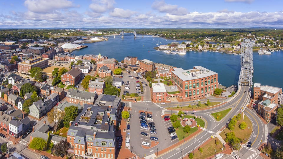 Portsmouth historic city center and Waterfront of Piscataqua River with Memorial Bridge aerial view, New Hampshire, NH, USA.