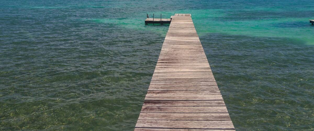 Seascape and wooden pier, St. Georges Caye, Belize, Central America