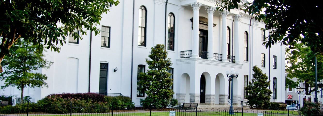 Courthouse in Town Square with Red Flowers