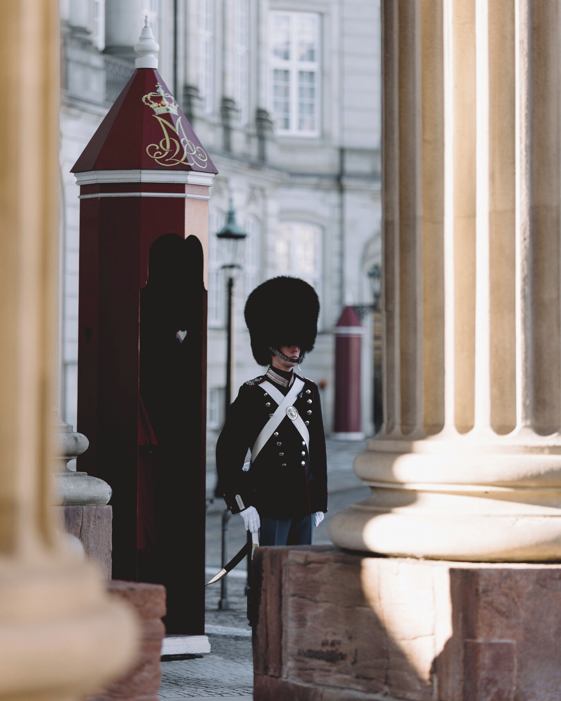 A royal guard at the palace in Copenhagen. Gorgeous architecture in the heart of Copenhagen, and thick with history.

Go around 12 if you wanna see the changing of the guard. Its pretty cool.