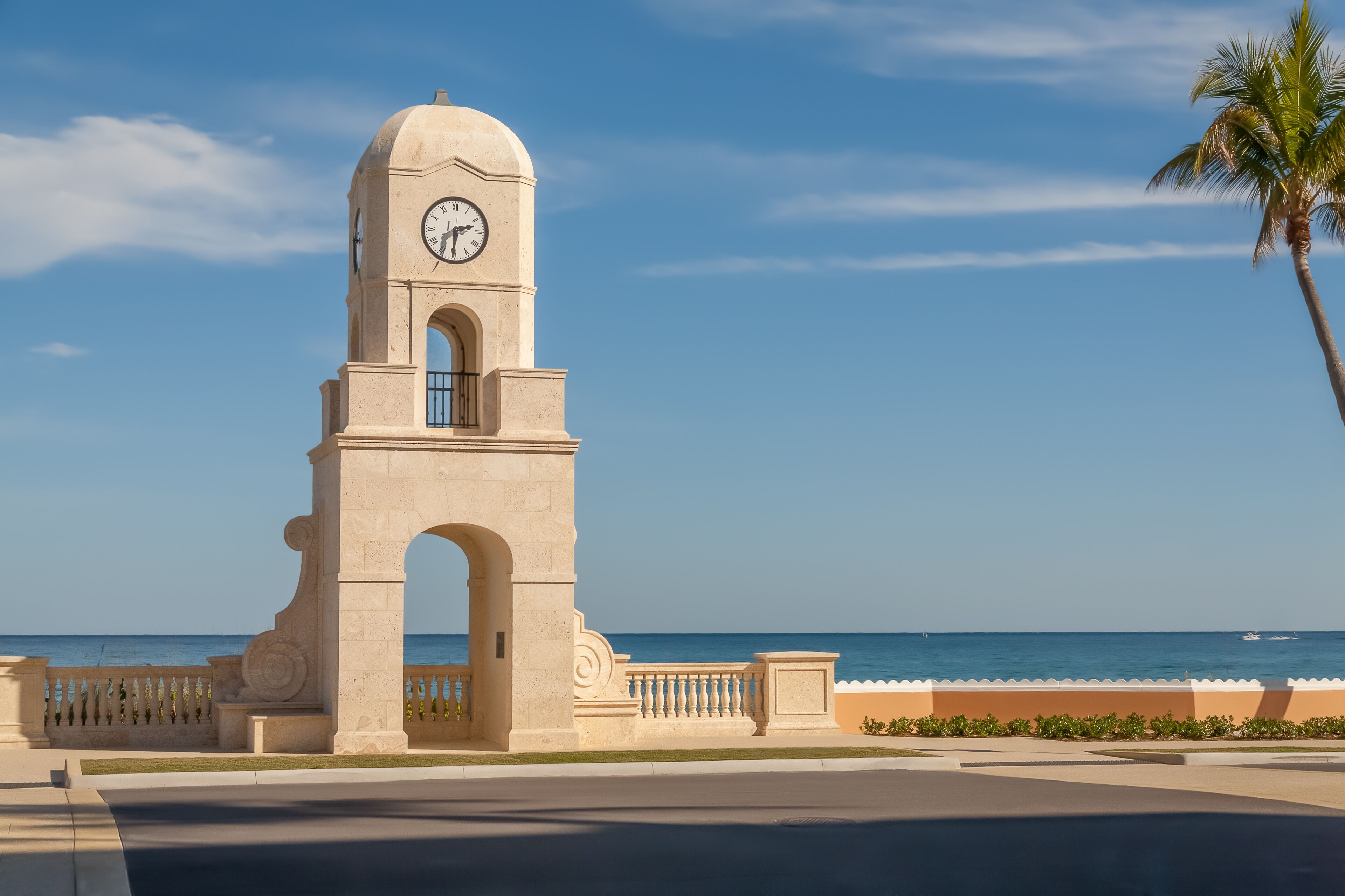 The beautiful warm sunny day filled with blue skies and turquoise water sets the backdrop for the stone clock tower overlook.
