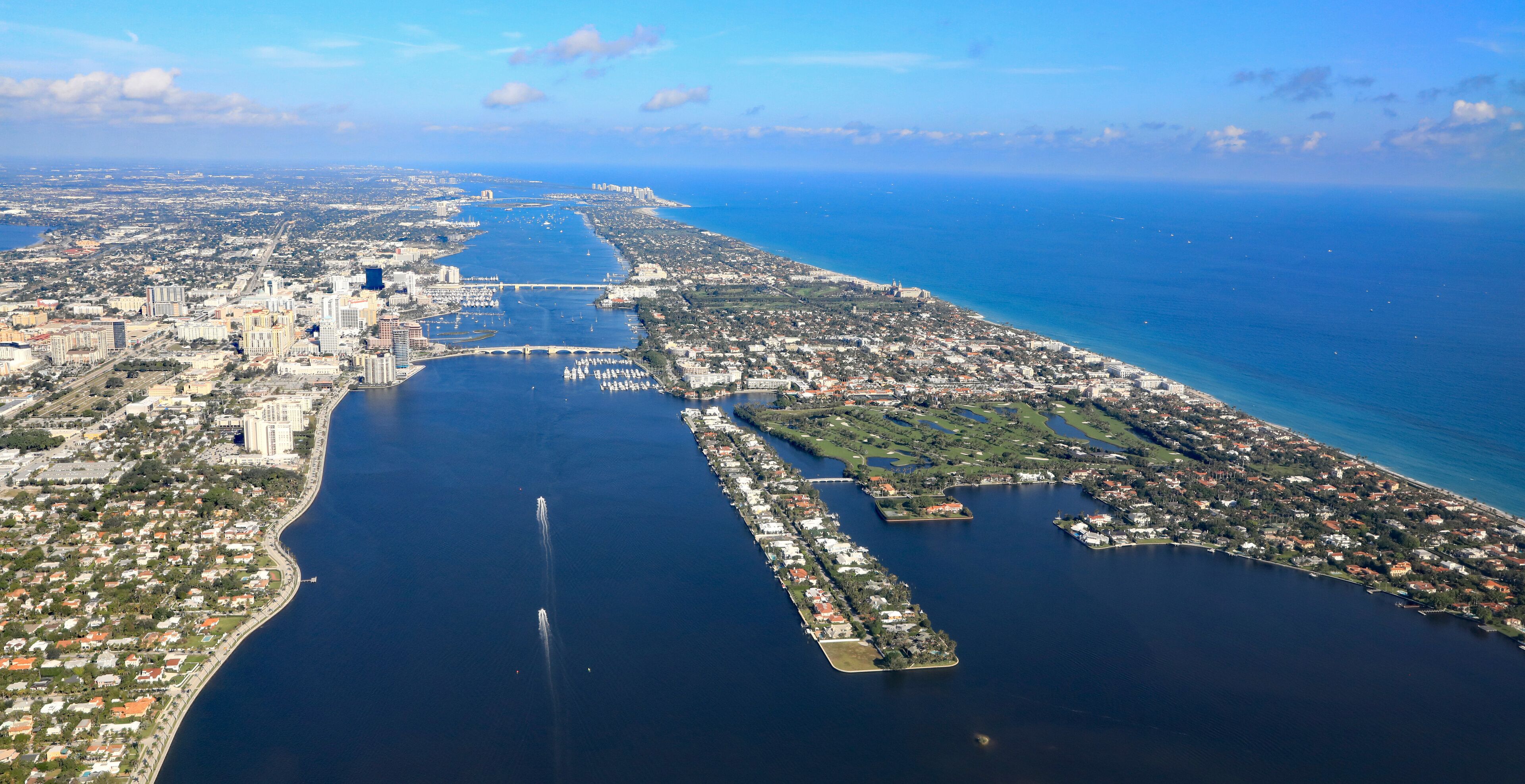 Aerial view of downtown West Palm Beach, Florida, with the Lake Worth Lagoon, and Palm Beach,  in South Florida.