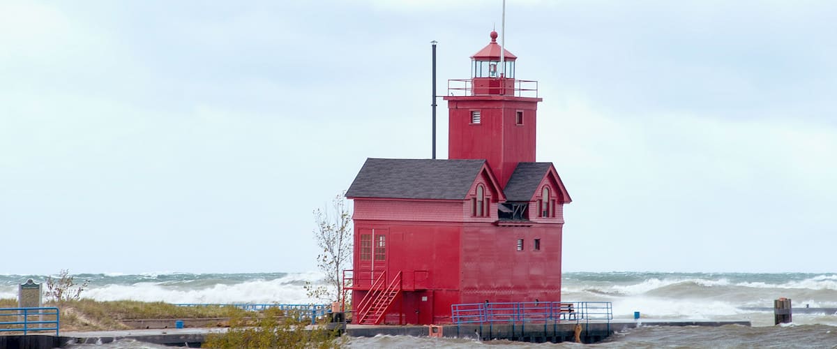 Holland Michigan Big Red lighthouse with high water level and waves
