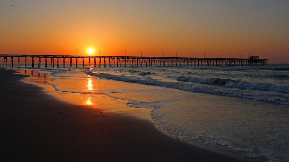 A beautiful sunrise over the Seaview Pier on North Topsail Island in North carolina.