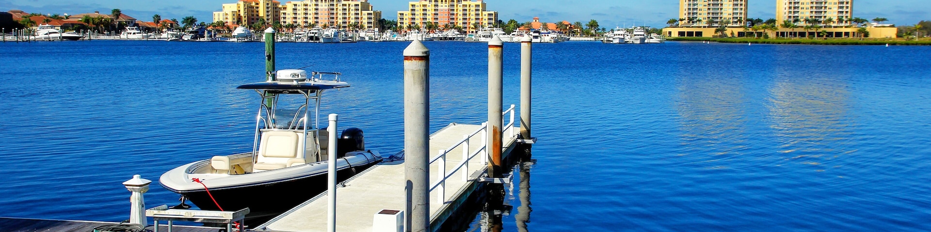 Dock with a motorboat in Palmetto, Florida; Shutterstock ID 545262166