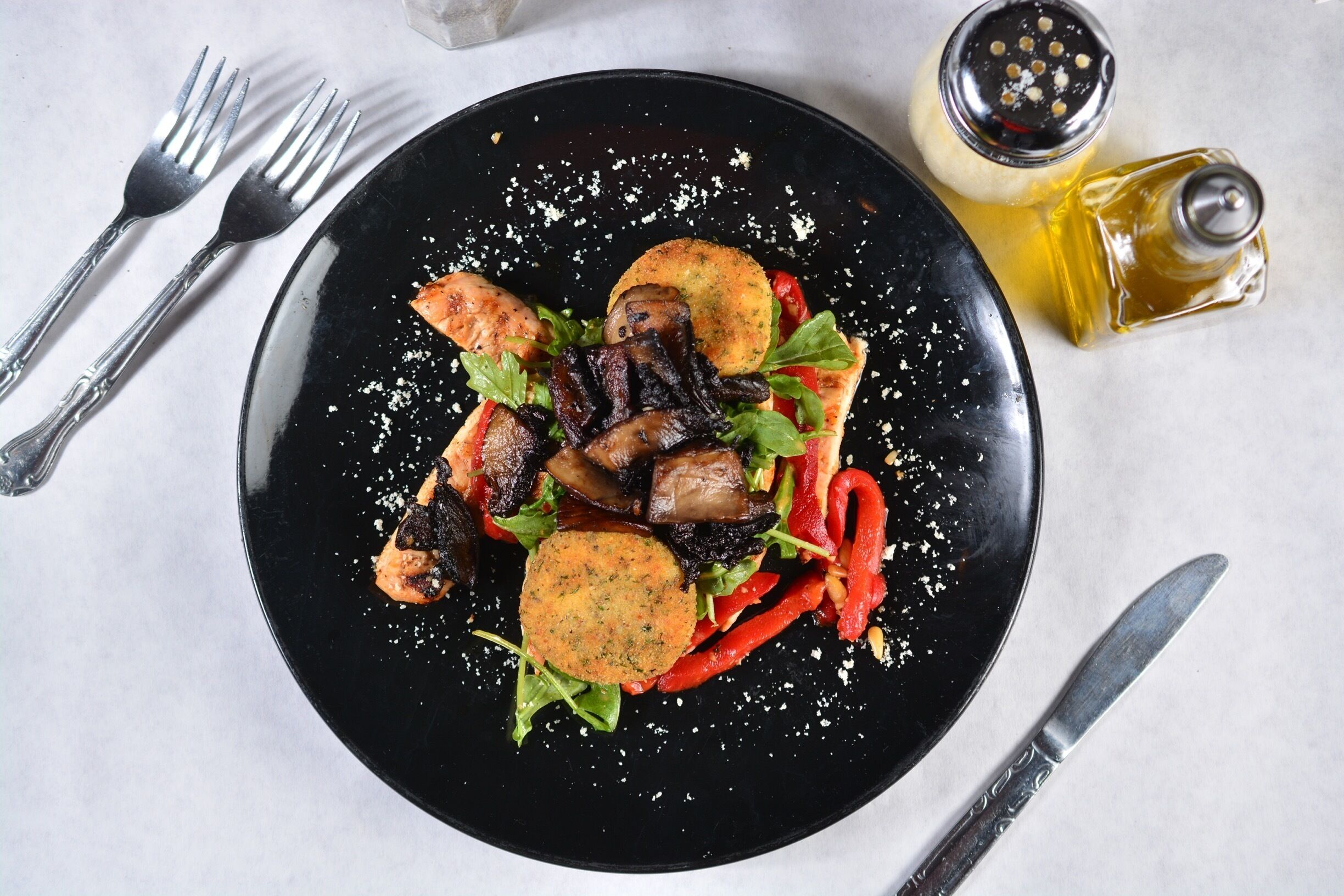 You'll want to go out of your way for this one... 

Chef Flamini at Sam Buca's Restaurant is serving up a Grilled Chicken dish tossed with roasted red peppers and pine nuts, accompanied with an arugula salad sprinkled with blue cheese. A chipotle aioli accents two pan-fried boules de fromage de chèvre, topped with caramelized portabellas.

Seriously, probably one of the best things I have tasted in any restaurant!