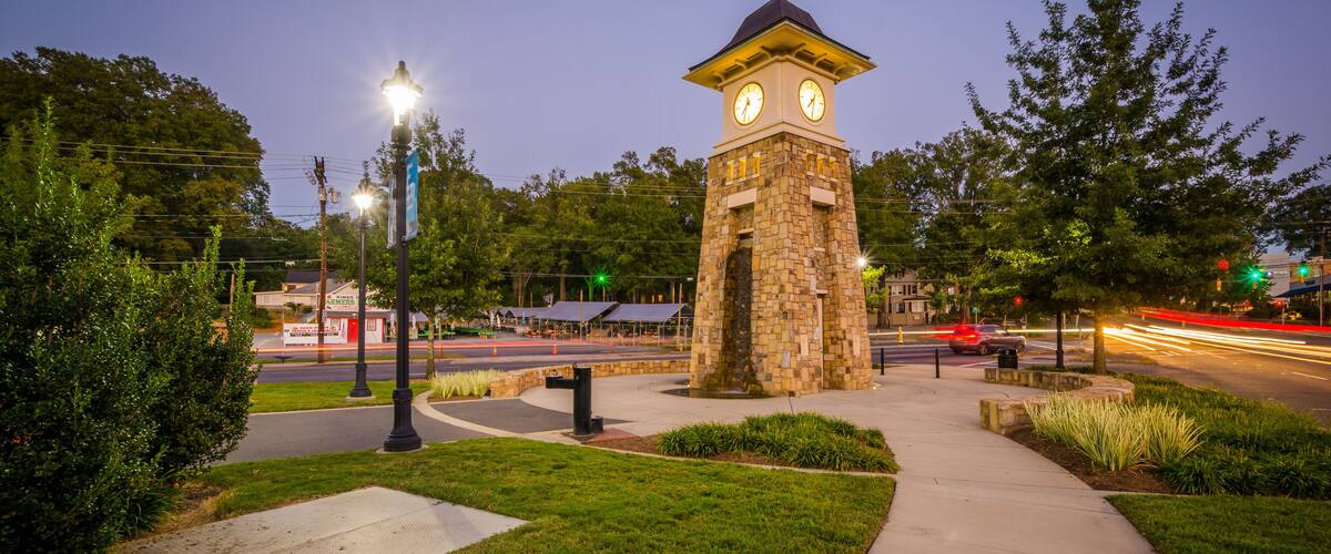 Clock tower at night, along the Little Sugar Creek Greenway, in