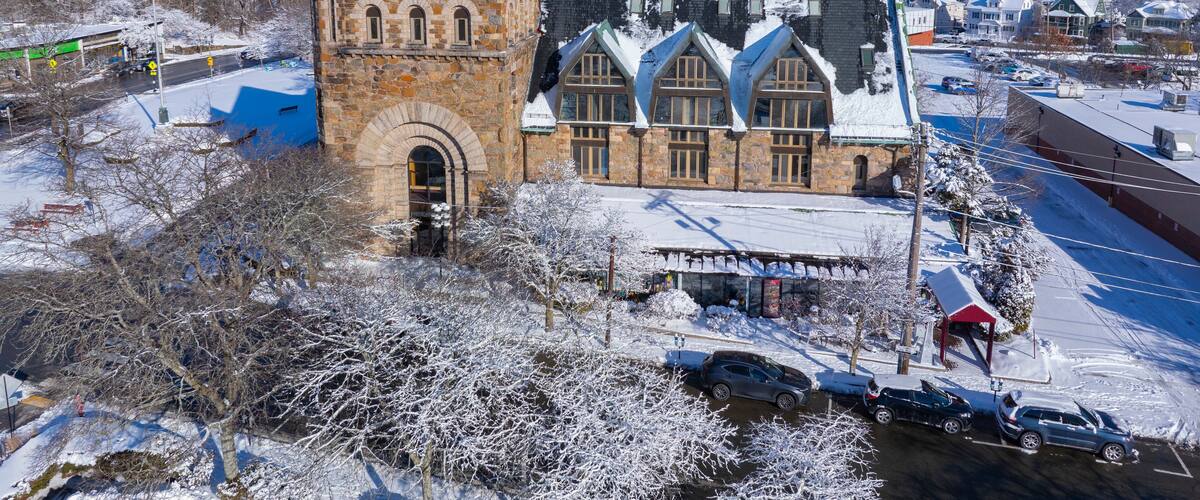 Newton Centre Methodist Episcopal Church aerial view in winter at 10 Langley Road at Newton Centre in city of Newton, Massachusetts MA, USA.