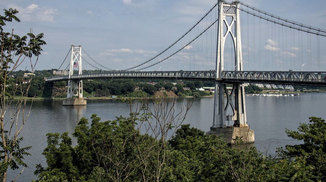 view of the mid hudson bridge to poughkeepsie, new york from highland (suspension bridge over river crossing) scenic landmark (pedestian and bike path, car lanes highway) valley ny state detail