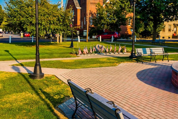 Bench and a church on the town square in New Oxford, Pennsylvani