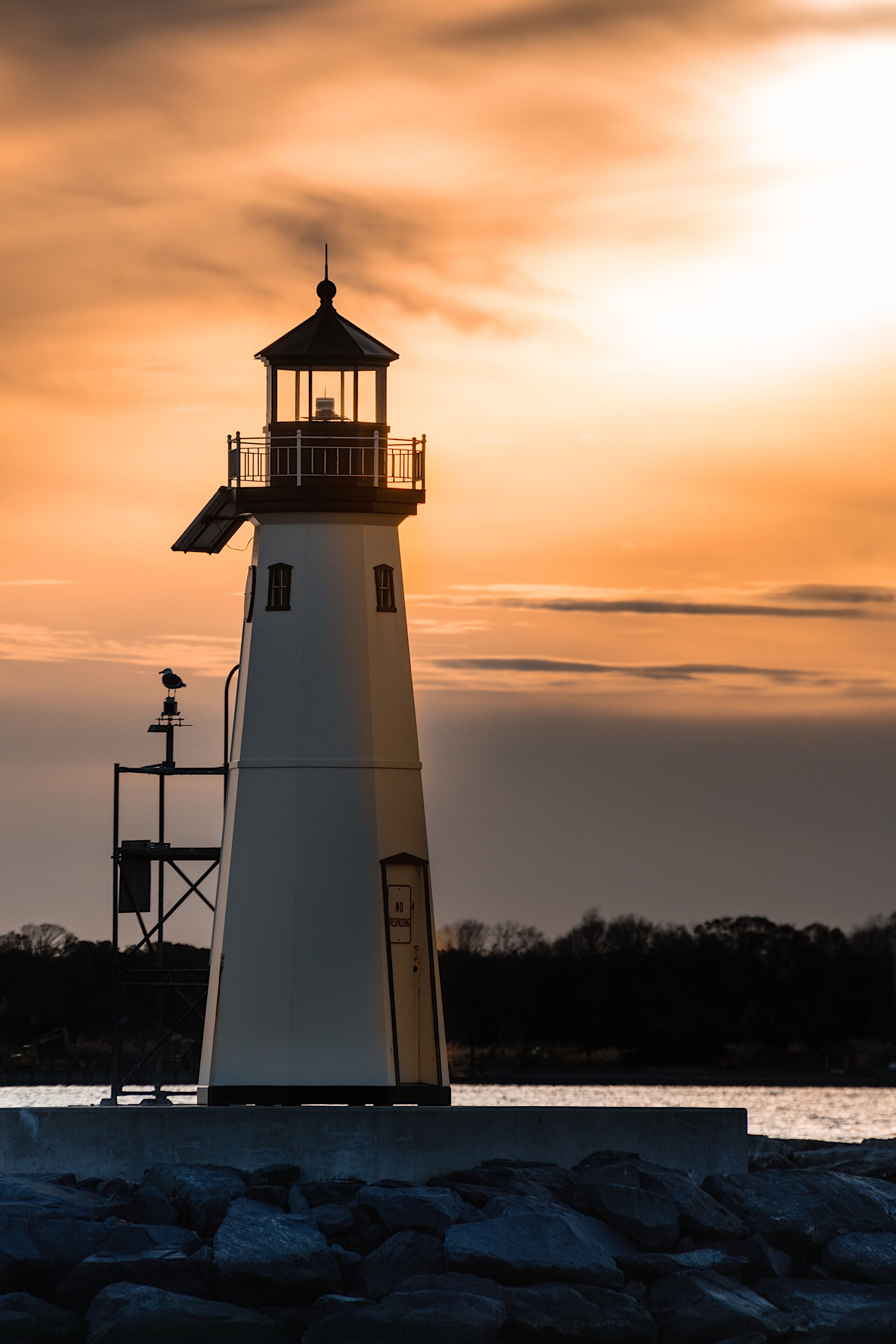 A close up view of the lighthouse in Sandspit marina,  Patchogue, New York, in the evening  during sunset