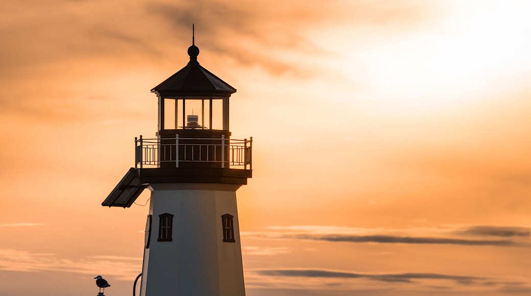 A close up view of the lighthouse in Sandspit marina, Patchogue, New York, in the evening during sunset