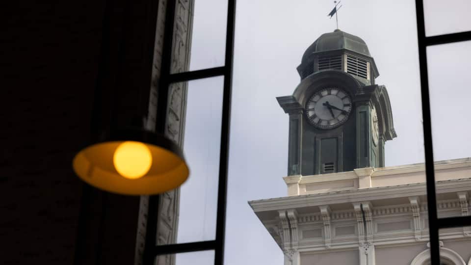 A historic window and banking style lamp frame historic architecture in downtown Petaluma, California, USA.