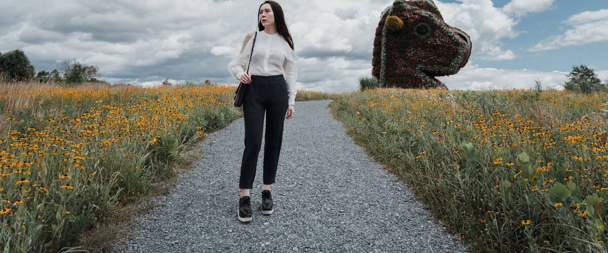Young woman in white with plant sculptures in the glenstone museum Maryland