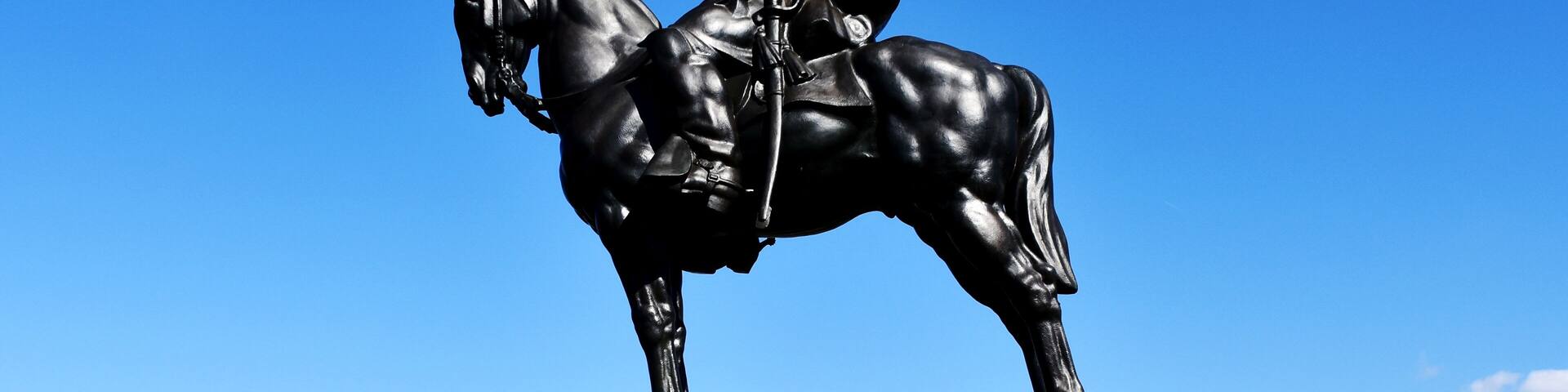 A statue of a man on horseback with a plaque that reads "There stands Jackson like a stone wall."