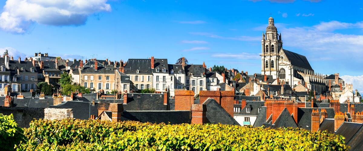 A historic town with a prominent church tower and densely packed residential buildings.