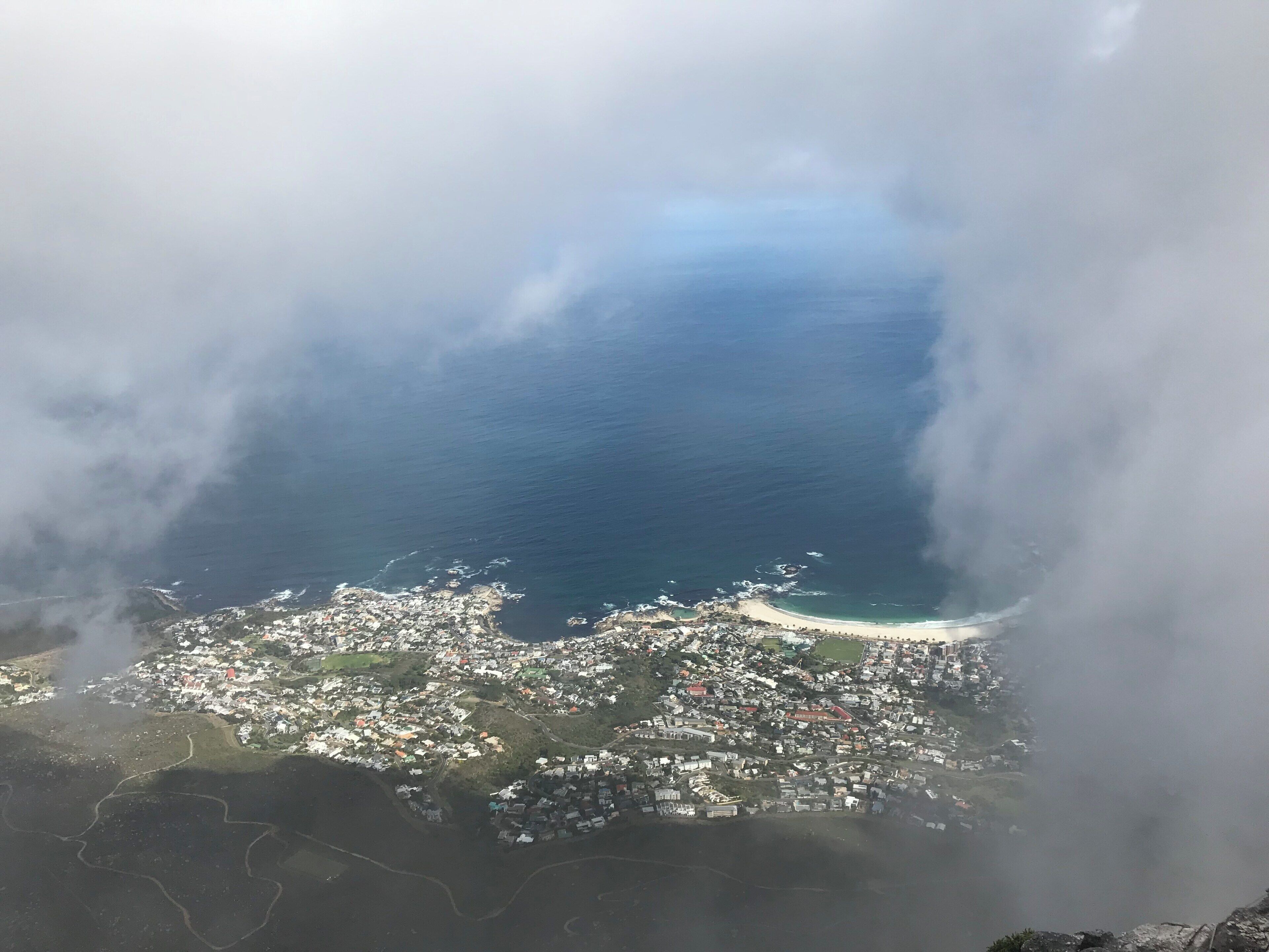 Looking down at Cape Town through the clouds